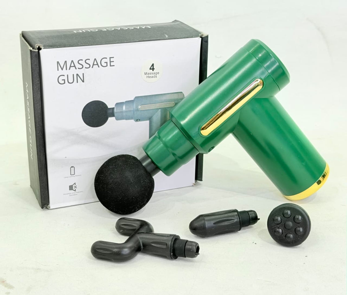 PISTOLA DE MASAJES CON 4 CABEZALES INTERCAMBIANLES