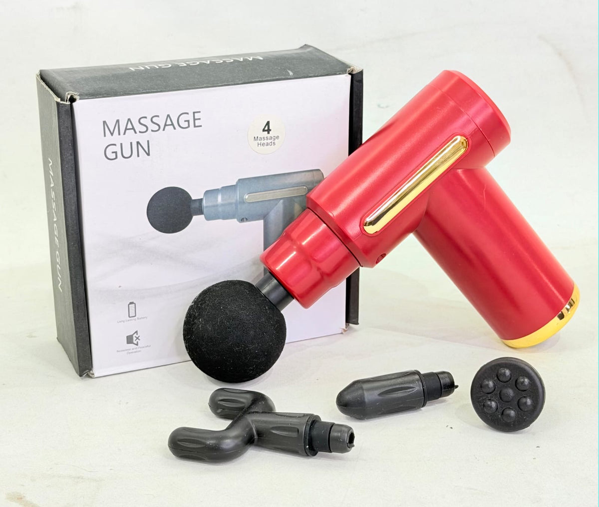 PISTOLA DE MASAJES CON 4 CABEZALES INTERCAMBIANLES